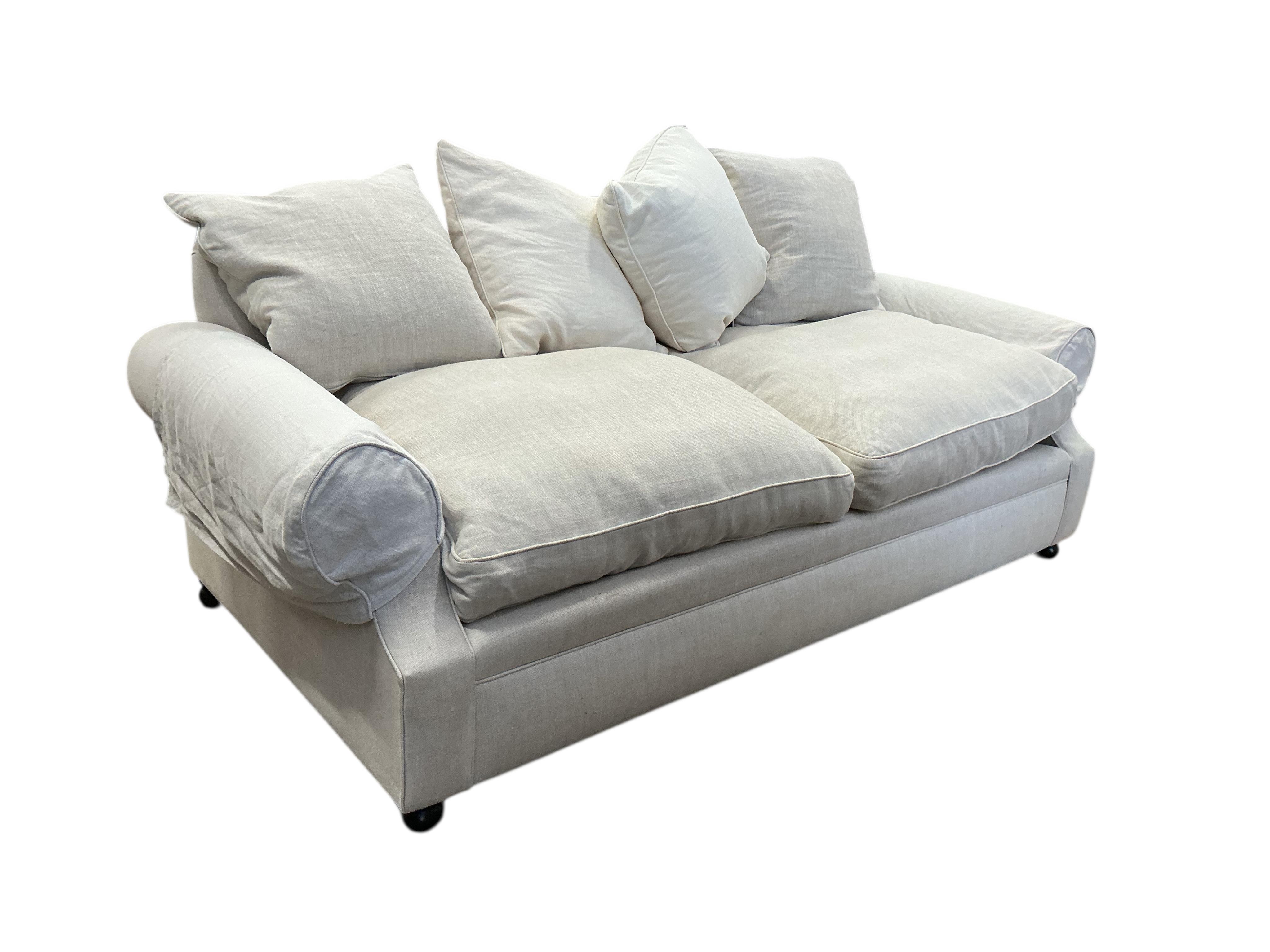 A Contemporary three seater sofa upholstered in natural fabric, width 220cm, depth 100cm, height 90cm